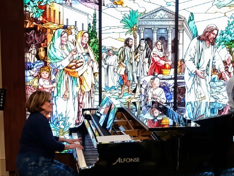Shawna Edwards — composer of "The Miracle," a new addition to Hymns for Home and Church — plays the piano at the Rome Temple Visitors' Center in Rome, Italy, in April 2026.