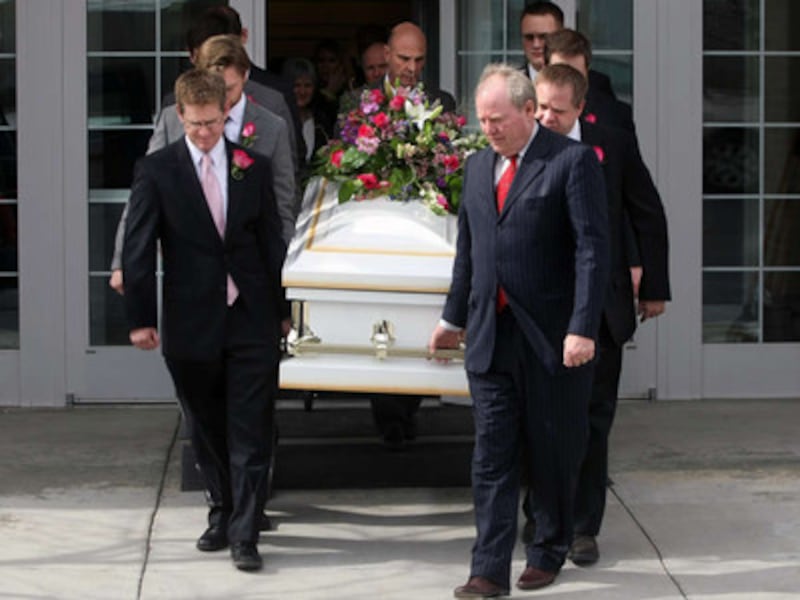 Pallbearers transport the casket of Sister Ruth Hardy Funk, former Young Women general president.