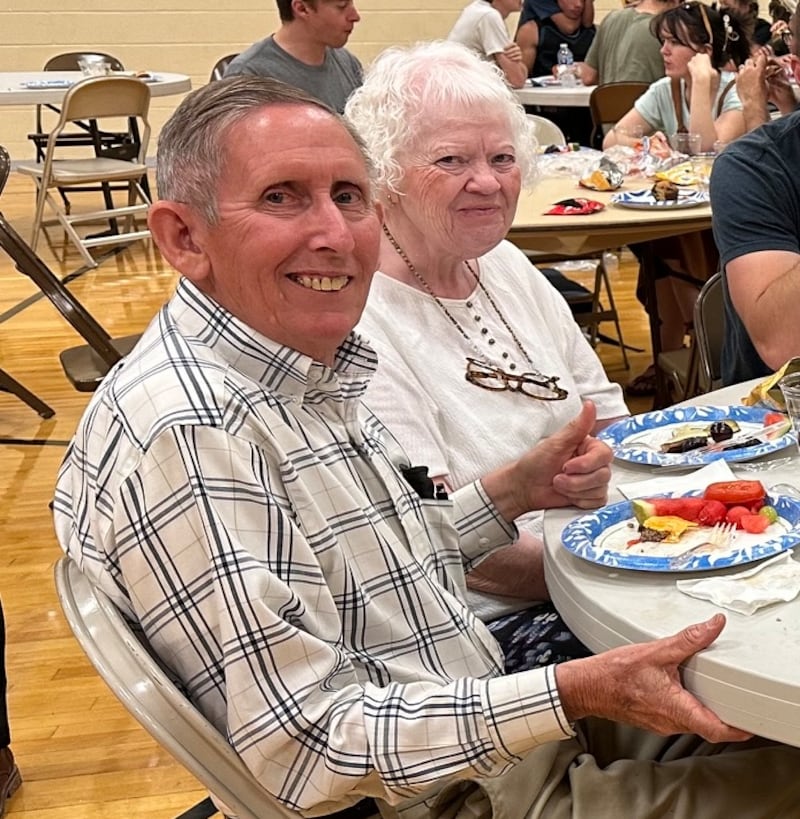 Dan and Winona Carlile enjoy a meal for evacuees in the Pueblo Colorado Stake Center on July 10, 2026. The Carliles were evacuated due to the Aspen Acres fire burning near their home in Colorado City, Colorado.