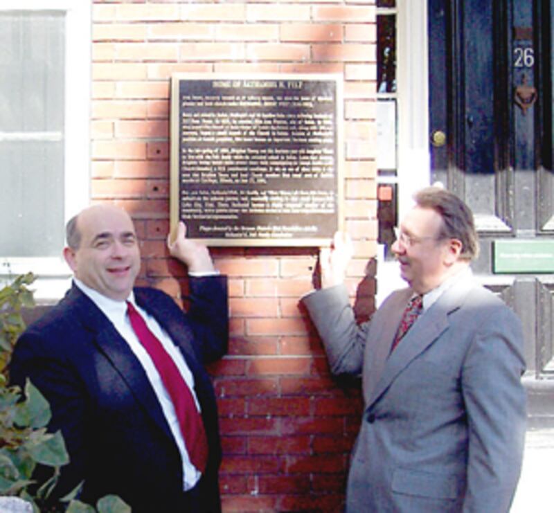 Jonathan C. Felt, left, great-great-grandson of Nathaniel H. Felt, and Kim R. Wilson display newly d