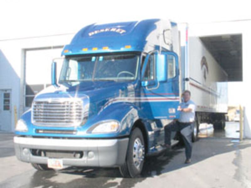 Driver Allen Humphries washes truck carrying hygiene kits at Salt Lake City on Sept. 22. Kits were l