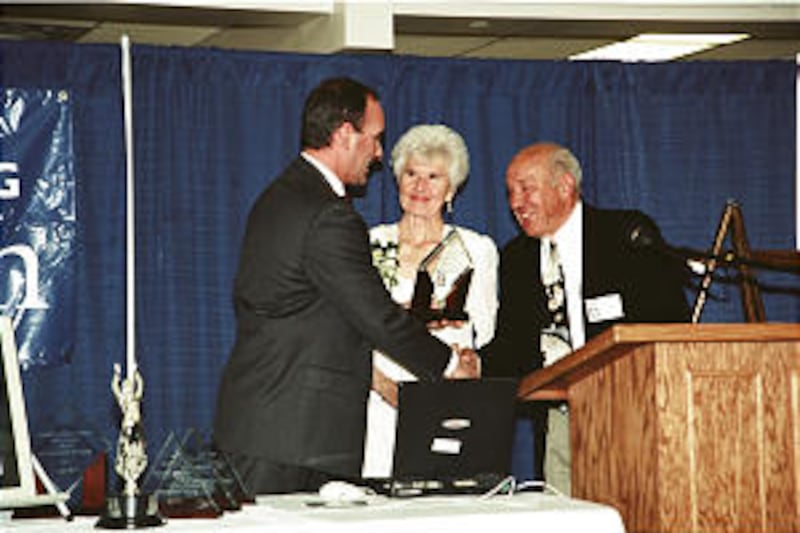 FSA National Board Co-Chair Tom Nickell presents Adoption Hall of Fame Award to Dale and Jo Ann Trum