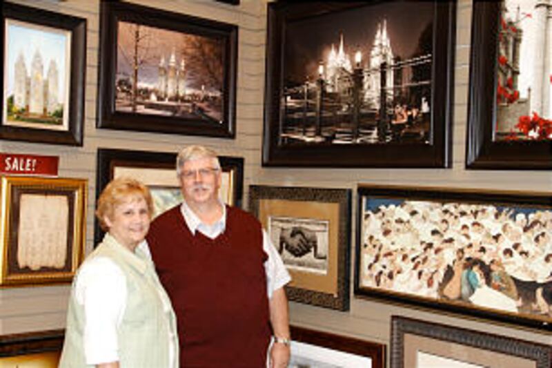 Norbert and Heidi Schmidt inspect artwork at the new Deseret Book flagship store in downtown Salt La