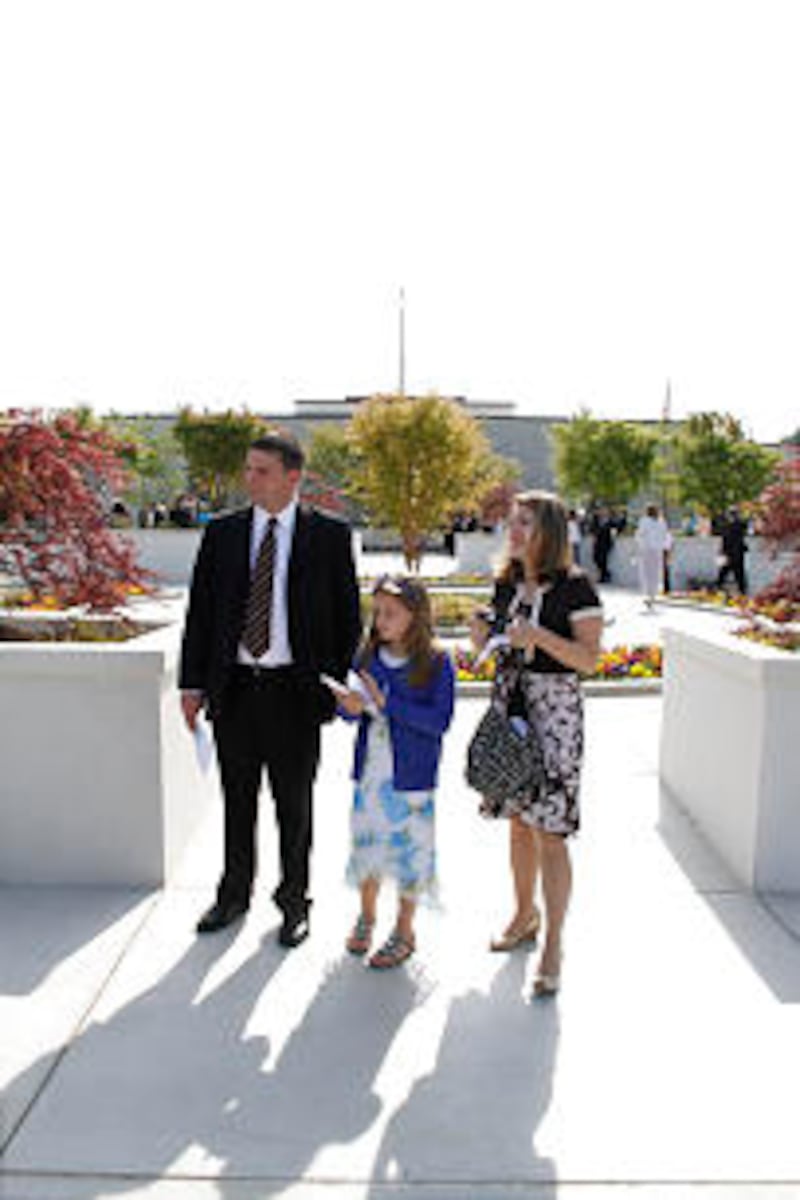 Danny and Jaime Waxter and their daughter, Madelyn, of Winder, Ga., attend rededication of the Atlan
