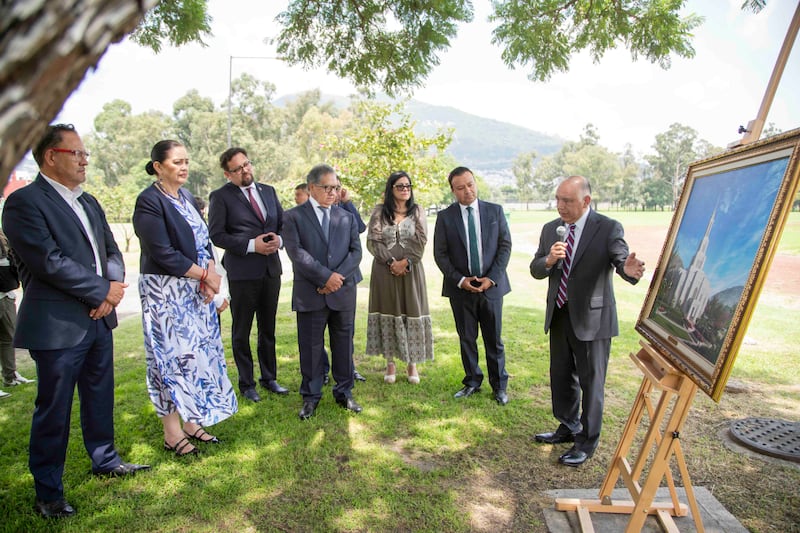 Right, Elder Moisés Villanueva, a General Authority Seventy and president of the Church's Mexico Area, shows members of the Mexico Senate a rendering and the site of the future Mexico City Benemérito Mexico Temple in Mexico City, Mexico, on Friday, Aug. 28, 2026.