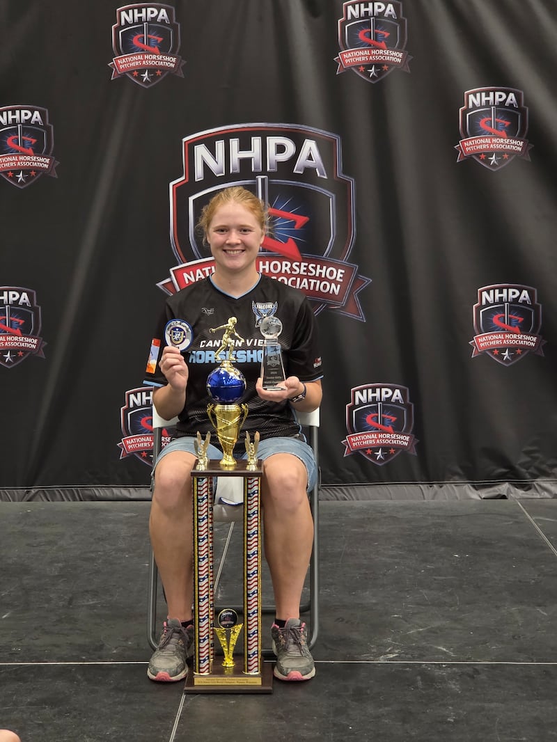 Adilaide Ohms, 18, poses with her trophies after winning the 2026 National Horseshoe Pitchers Association World Horseshoe Tournament on July 18, 2026.