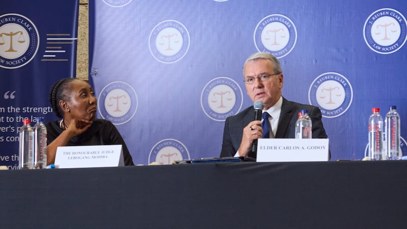 Elder Carlos A. Godoy and Judge Lebogang Modiba speak at a religious freedom conference in Johannesburg, South Africa, Aug. 8, 2026.