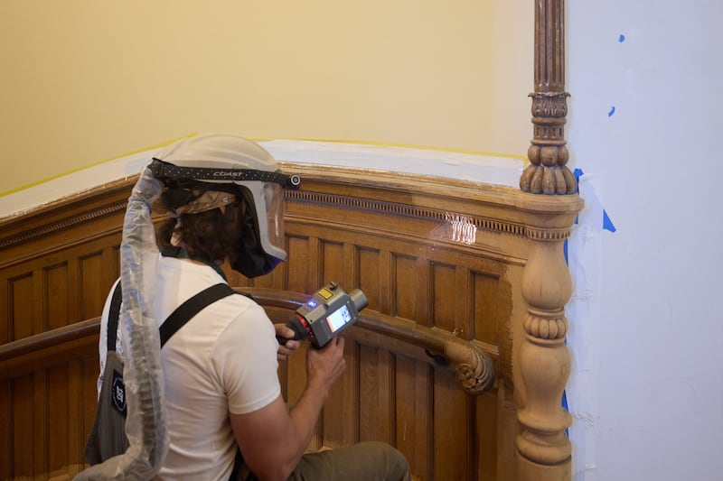 Old varnish is removed with a pulse laser in the Salt Lake Temple on Tuesday, April 21, 2026, in Salt Lake City.