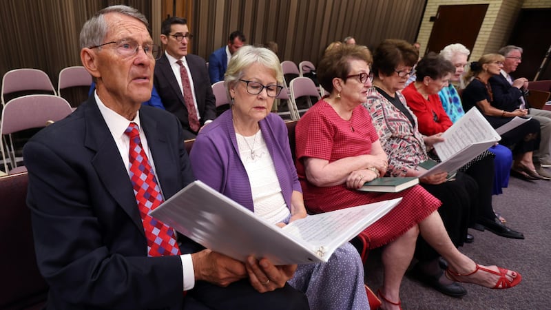 Church members sing hymns during their sacrament meeting in Murray, Utah.