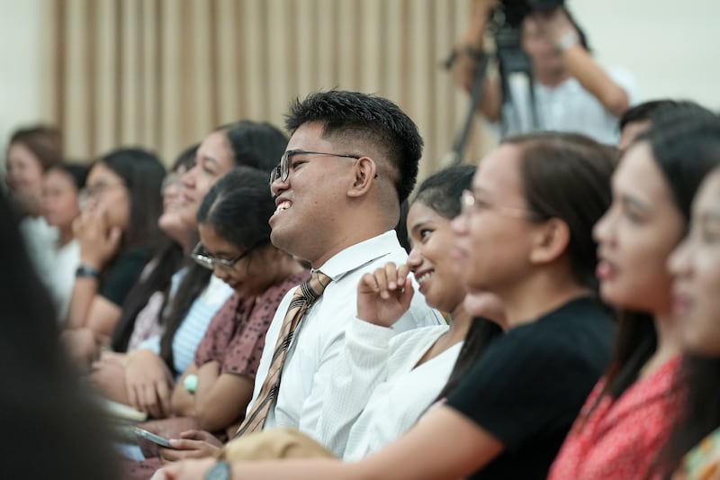 Young single adults listen and react during a devotional meeting with Elder Ulises Soares of the Quorum of the Twelve Apostles in Cebu, Philippines, May 16, 2026.