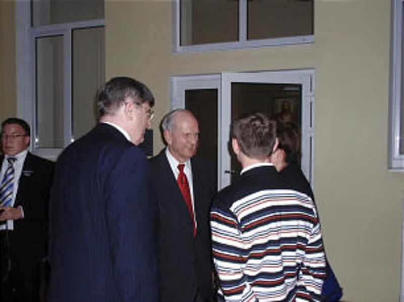 Elder Russell M. Nelson poses with members following the dedication of the Voronezh Branch meetingho