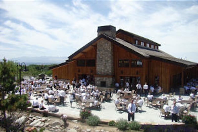 Participants of the 2013 BYU Fathers and Sons Basketball Camp gather for a Sunday lunch at This Is t