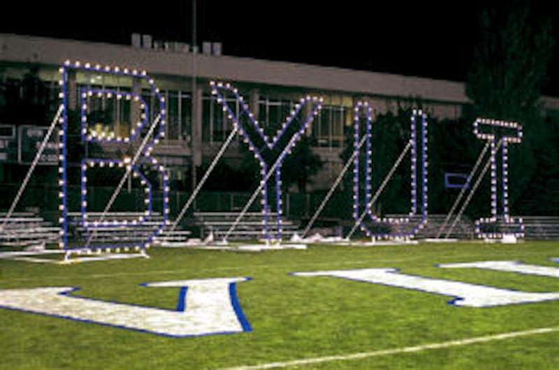Above, twinkling lights on a BYU-Idaho sign constructed by the school's welding department shines on