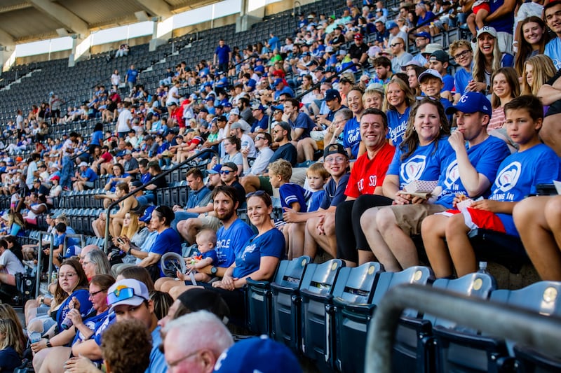 Fans gather on "JustServe Night" at a Kansas City Royals baseball game. Elder Gary E. Stevenson of the Quorum of the Twelve Apostles threw the ceremonial first pitch at the game on Tuesday, August 6, 2024.