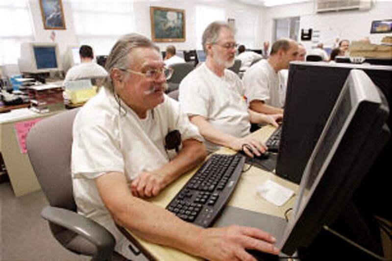 Inmate Austin Sumner, front, says the center helps inmates have a change of heart.