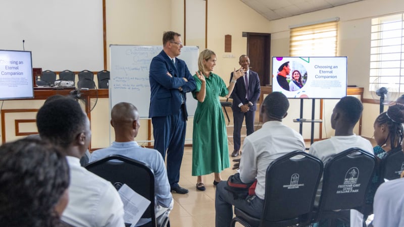 Elder Clark G. Gilbert of the Quorum of the Twelve Apostles, left, and his wife, Sister Christine Gilbert, right, talk with an institute class in Freetown, Sierra Leone, on Wednesday, Aug. 26, 2026.