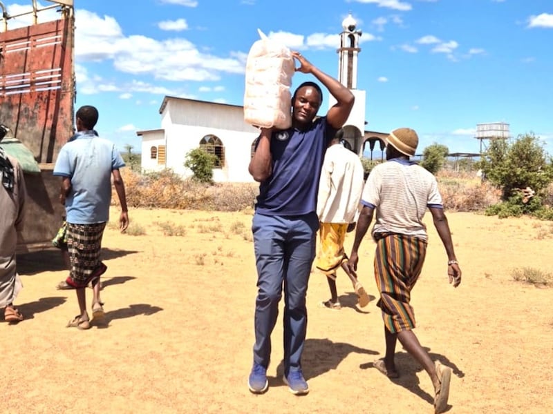 Denis Mukasa unloads food for distribution in Korr, Kenya, May 29, 2026.