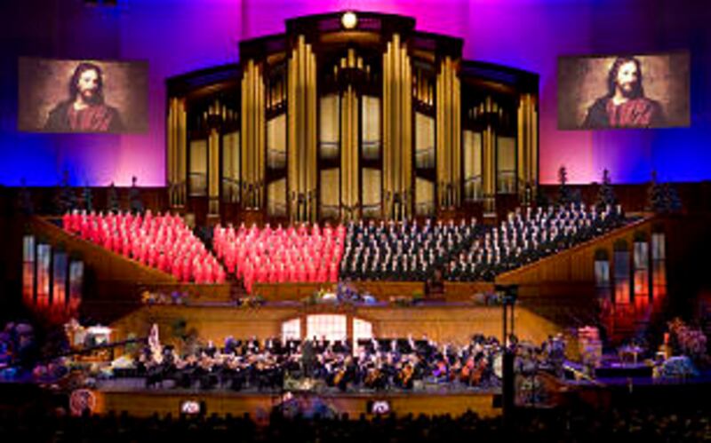 A portrait of Christ is projected on screens above the Mormon Tabernacle Choir and Orchestra at Temp
