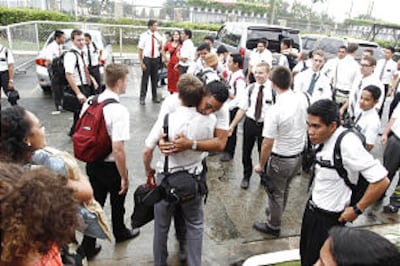 Young people serving in the Philippines Tacloban Mission visit with one another before receiving new