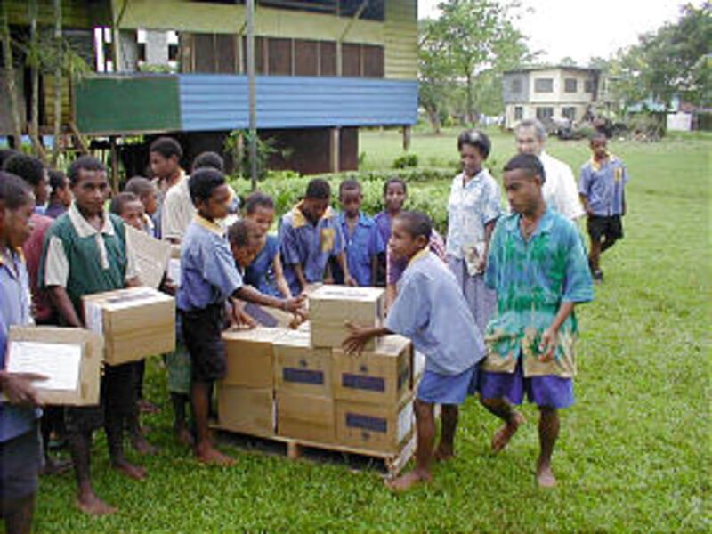 120 schoolbooks and 10 education kits are received by students at Papua New Guinea's Kariva School.