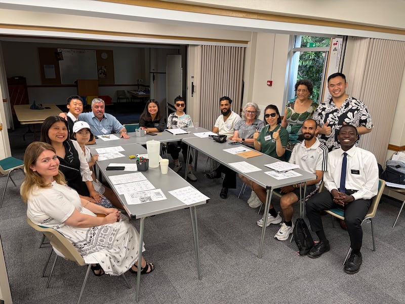 Teachers, students and missionaries smile for a picture during an EnglishConnect class at the Bournemouth Ward building in the Southampton England Stake on Tuesday, July 14, 2026.