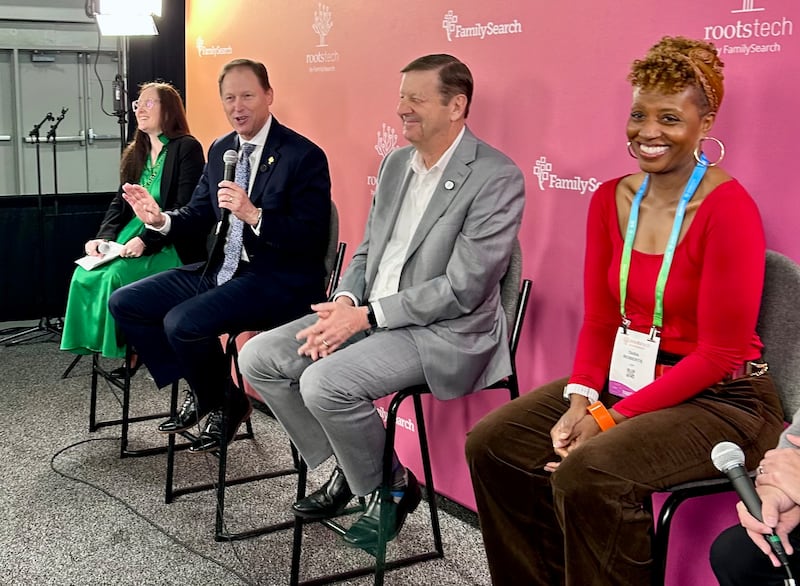 Elder Mark A. Bragg holds a microphone to respond to a question during a panel interview at RootsTech 2026.