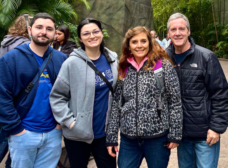 Anna Rast, second from right, smiles with her family while in Orlando, Florida, February 2024.