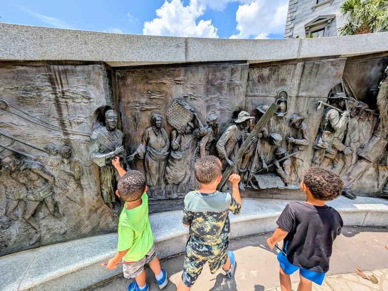 Vanessa Duerson's three sons explore the African American History Monument in Columbia, South Carolina, on June 27, 2025.