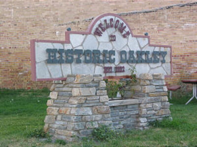 Sign at the main intersection in Oakley, Idaho, welcomes visitors and records settlement date as 188
