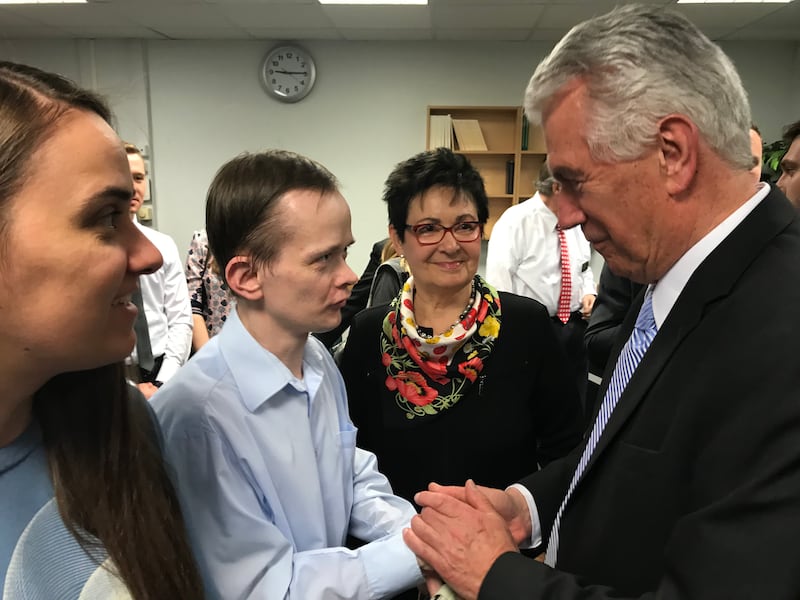 Elder Dieter F. Uchtdorf of the Quorum of the Twelve, right, and his wife, Sister Harriet Uchtdorf, greet young single adults after a devotional in Moscow on April 24, 2018.