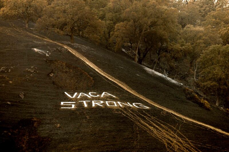 Following the LNU Lightning Complex fires, a sign reading “Vaca Strong” adorns a charred hillside in Vacaville, Calif., on Monday, Aug. 24, 2020.