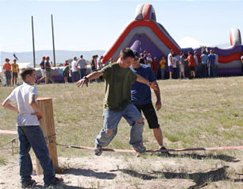 Scouts test their balance at one of the adventure centers at the 2013 Rise Up Scout Camp.