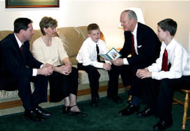 Young Men General President Charles W. Dahlquist II, second from right, discusses the Duty to God pr