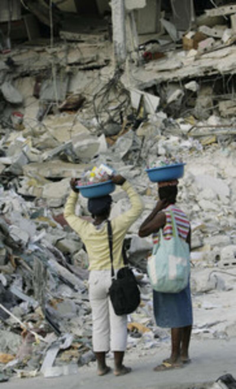 Haitians walk the streets in Port-au-Prince, Haiti, Thursday, Jan. 21, 2010.