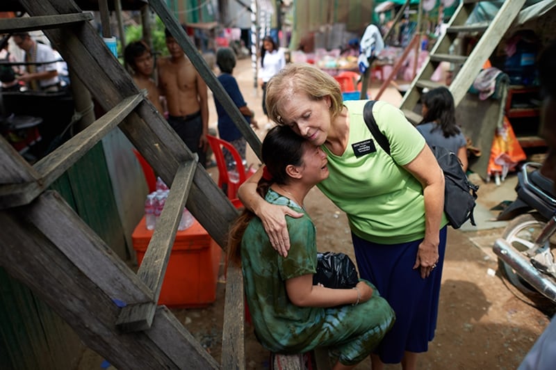 A senior missionary hugs a woman in Cambodia in 2024.