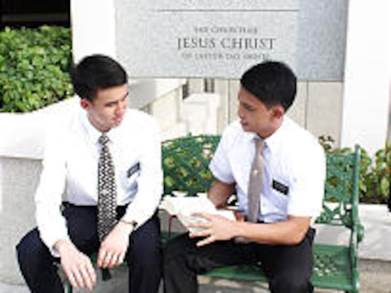 Elder Chia from Singapore and Elder Bahian from the Philippines go over scriptures outside the new m
