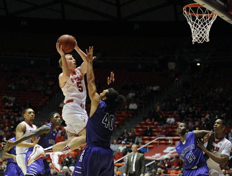 Utah Utes guard Parker Van Dyke goes for a basket at the Jon M. Huntsman Center on Thursday, Nov. 21, 2013.