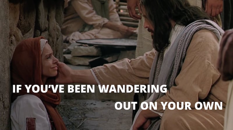 Jesus Christ comforts a woman in this scene from the "Greater Love" music video from Strive to Be.