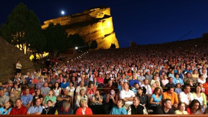The moon rises over Red Rocks Amphitheater as the Mormon Tabernacle Choir performs in Colorado.