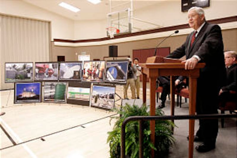 Displaying images of past environmental improvements to meetinghouses, Bishop H. David Burton detail