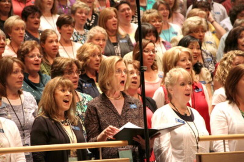 Sister Deborah Cardon, center, sings with the Mormon Tabernacle Choir during its sound check before