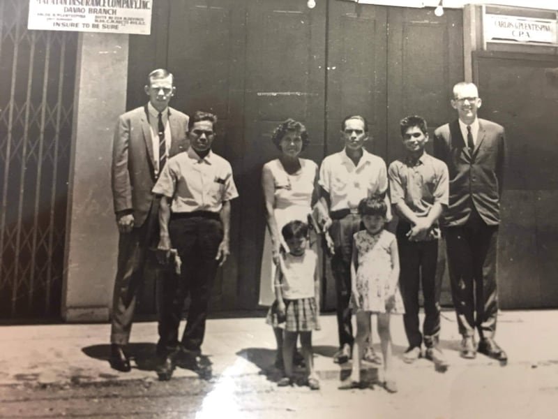 Cipriano Mumar and his family take a picture on the day of their baptism, June 29, 1968, in Davao City, Philippines, with Elder Lorenzo Bott and Elder Bruce Stone.