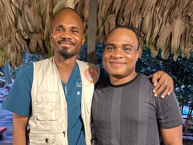Adolphus Togbah, left, stands with Konrad Barjuah. The two brothers from Liberia bring healthcare, education and hope to vulnerable communities across the country.