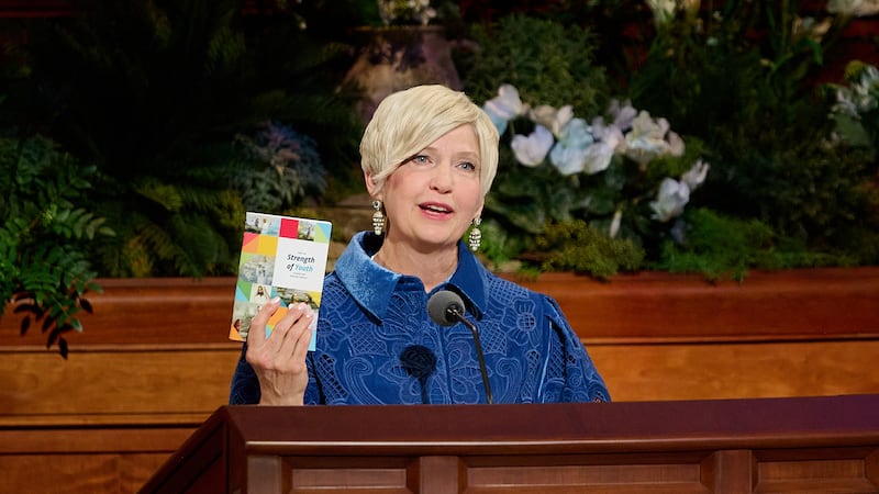 Young Women General President Emily Belle Freeman holds a copy of "For the
Strength of Youth" as she speaks during the Sunday morning session of the 196th Annual General Conference of The Church of Jesus Christ of Latter-day Saints in the Conference Center in Salt Lake City on April 5, 2026.