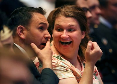 Erik Ramsay and Amy Ramsay react to the announcement of 12 new temples during the Sunday afternoon session of the 188th Semiannual General Conference of The Church of Jesus Christ of Latter-day Saints in the Conference Center in downtown Salt Lake City on Sunday, Oct. 7, 2018.