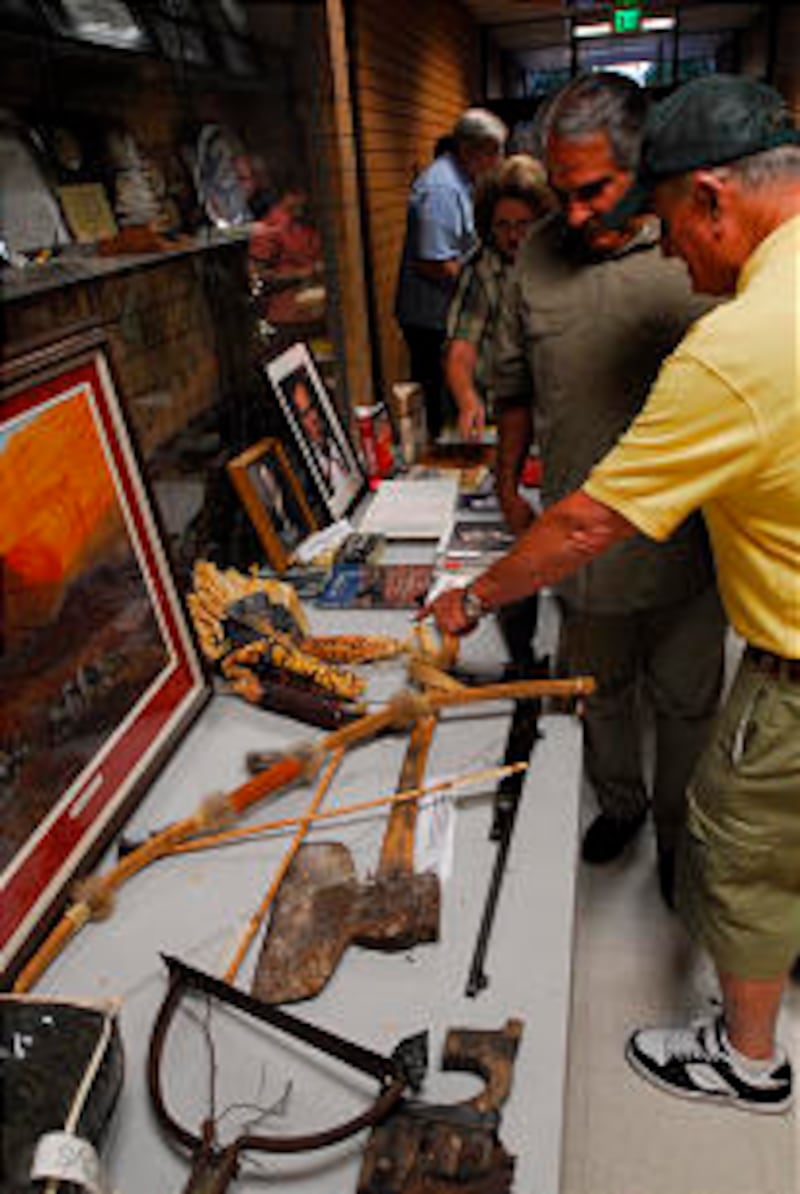 Jacob Hamblin's descendants examine artifacts of his era.