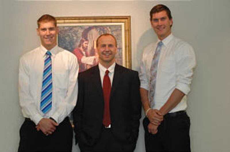 Bishop Jim Taylor stands with tall brothers Dallin, left, and Jordan Bachynski.