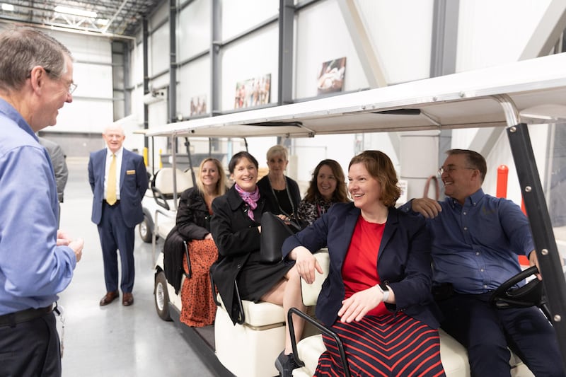 The leadership of Feeding America sit in a golf cart while touring the Church’s Bishops’ Central Storehouse.