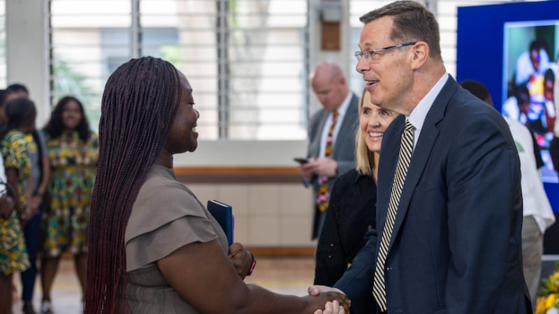 Elder Clark G. Gilbert of the Quorum of the Twelve Apostles, right, and his wife, Sister Christine Gilbert, behind him, greet BYU-Pathway students after a devotional in Accra, Ghana, on Friday, Aug. 28, 2026.