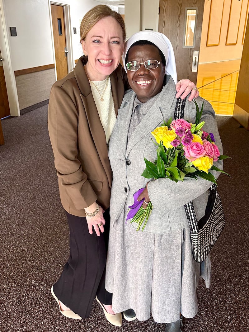 Katie Bailey and Sister Rosemary Nyirumbe smile after completing a devotional service project on March 8, 2026 in Norman, Oklahoma.